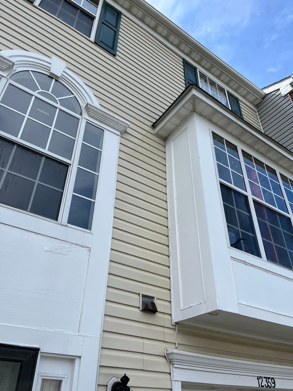 Two-storey bay windows on a home after professional exterior window cleaning