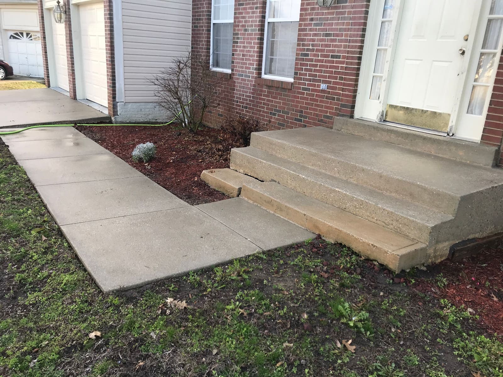 Concrete walkway and steps after pressure washing