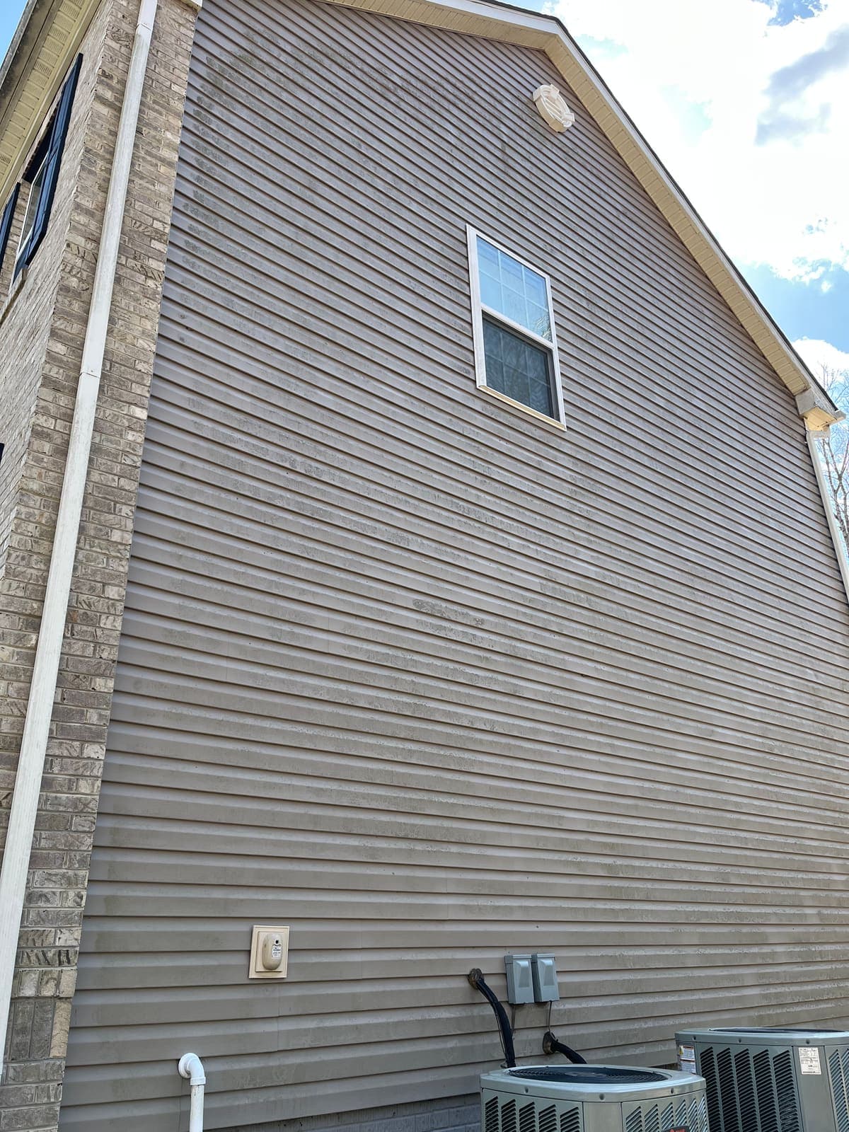 Siding gable end clean after soft washing
