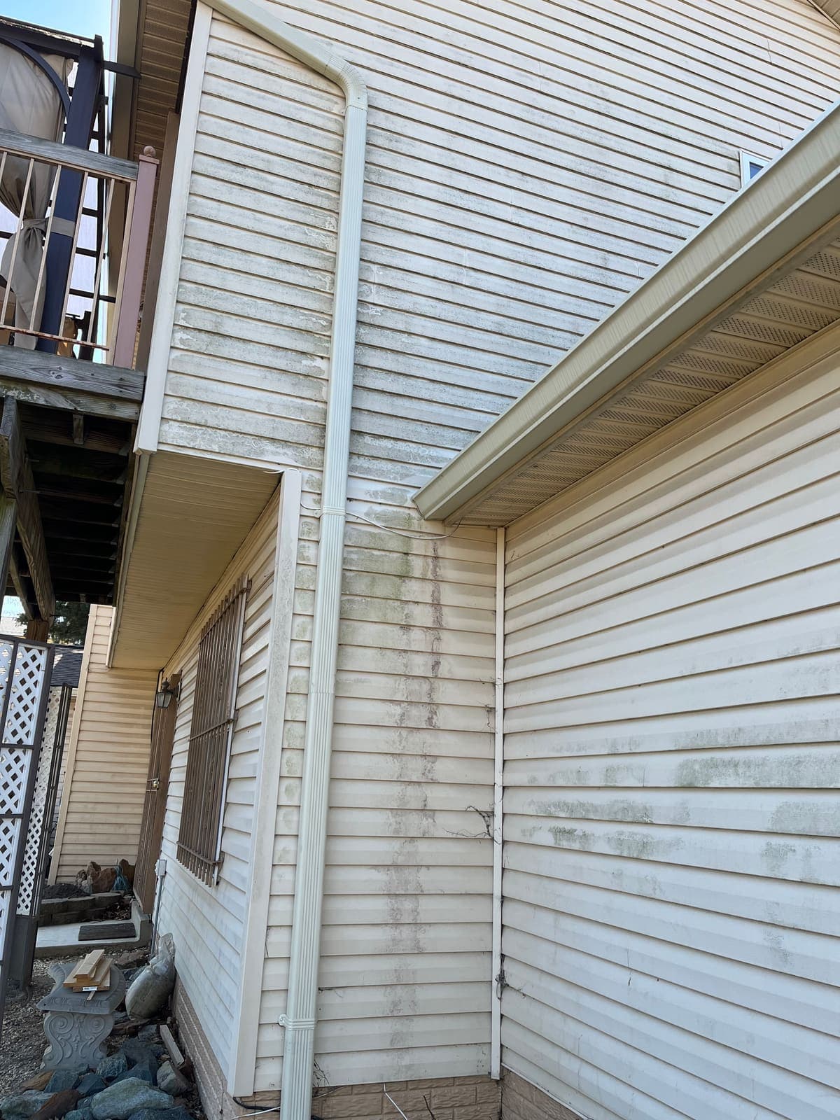 Mildew staining across siding before washing