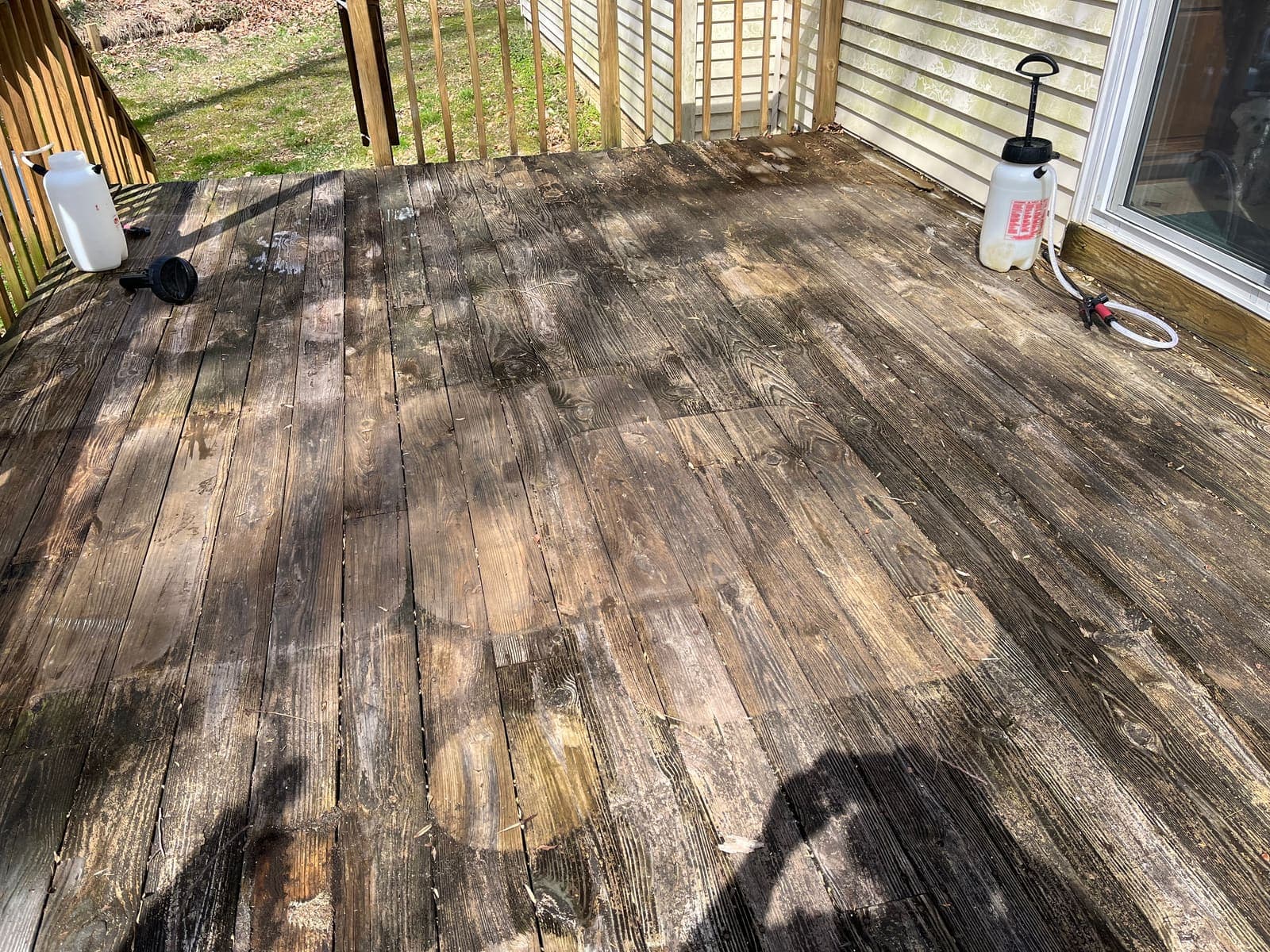 Sun-faded deck boards before cleaning