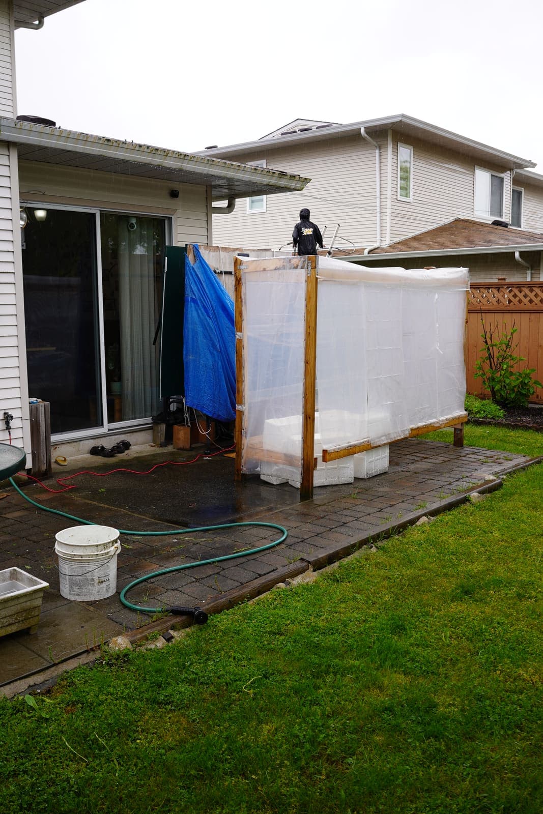 Townhouse backyard patio and lawn before cleaning