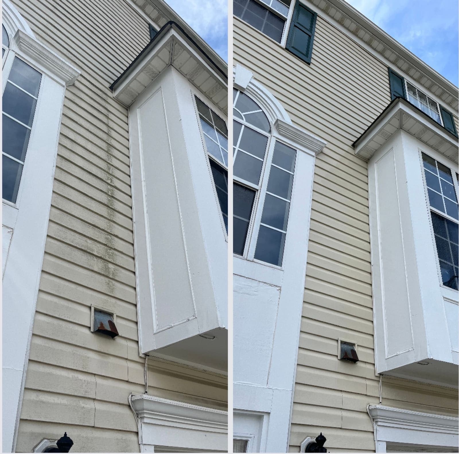 Clean white siding and bay windows on a townhouse exterior