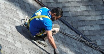 our team cleaning roof of our client
